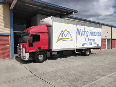 Wyong Removals & Storage truck in front of storage units dropping off a customers belongings for storage